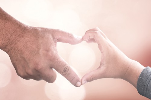 hands touching to make a heart - child mental health and meditation